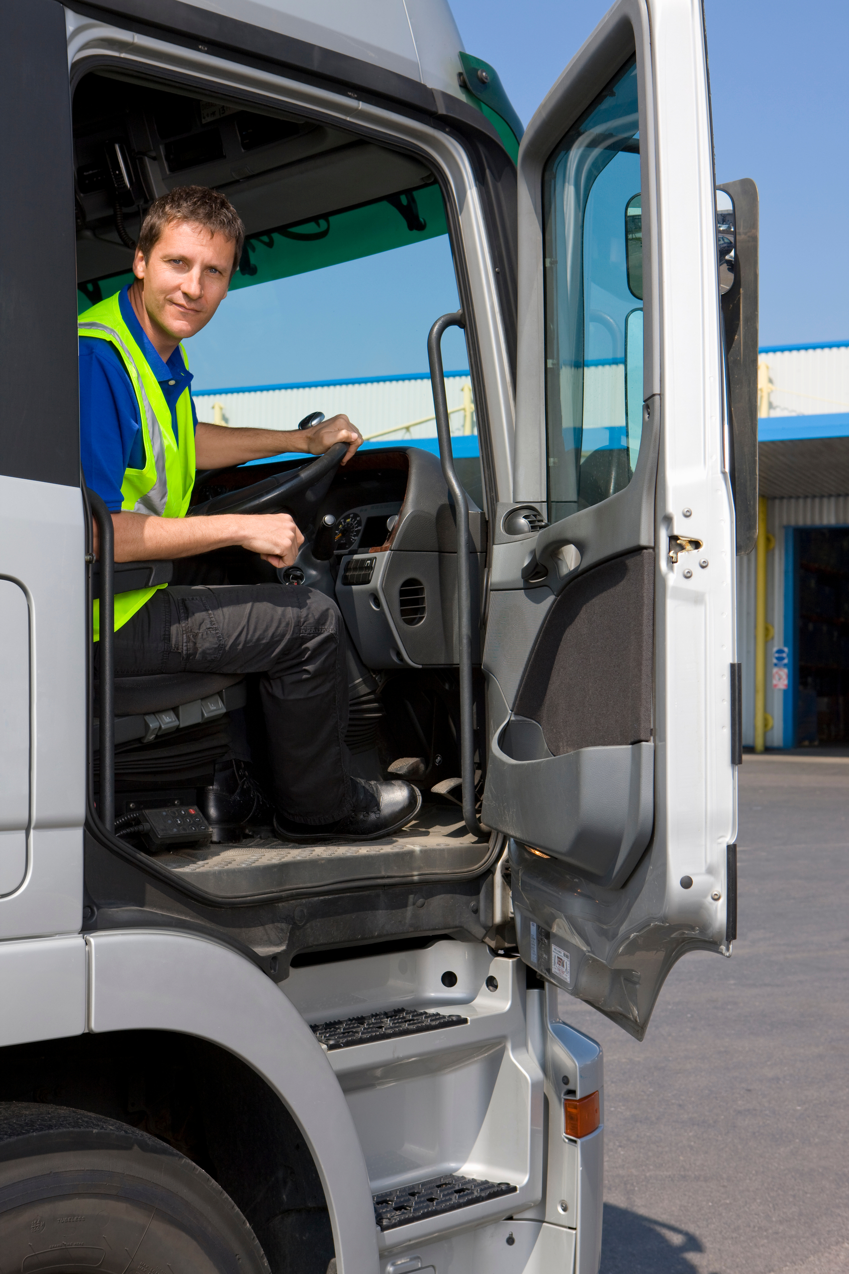 a-vertical-shot-of-truck-driver-sitting-behind-the-2025-10-15-05-03-32-utc1 ChatGPT